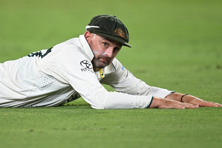 Nathan Lyon dives during Test match for Australia