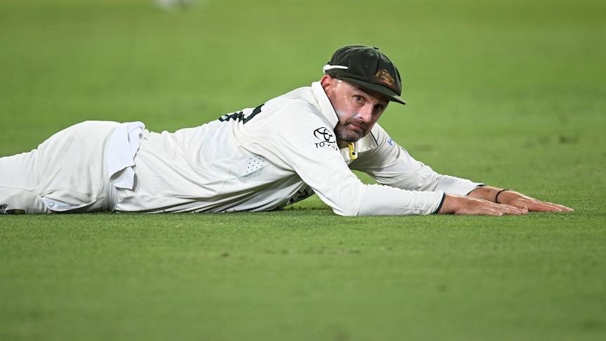 Nathan Lyon dives during Test match for Australia