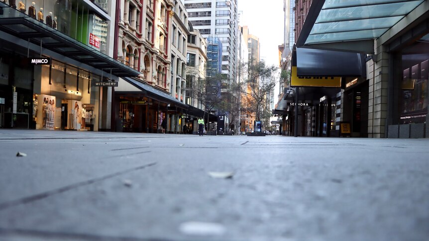 Empty retail strip in Sydney CBD, artistic shot from low down along pavement.
