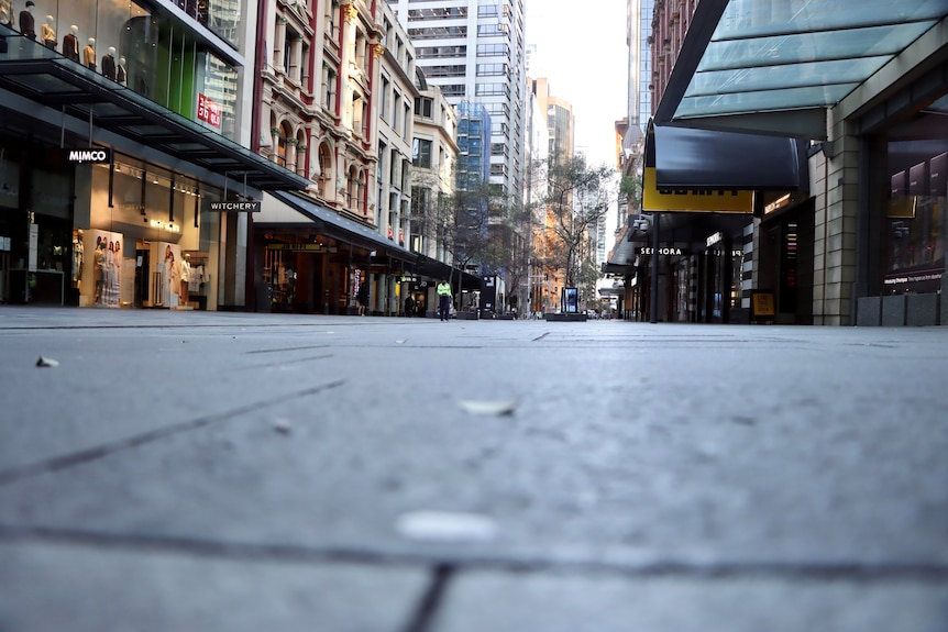 Empty retail strip in Sydney CBD, artistic shot from low down along pavement.