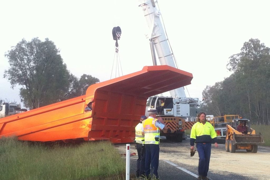 Crane and mine bucket blocking Cunningham Highway, west of Brisbane, after two trucks collided on April 19, 2013