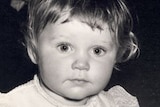 close-up black and white image of Anne Haylock's face as a toddler