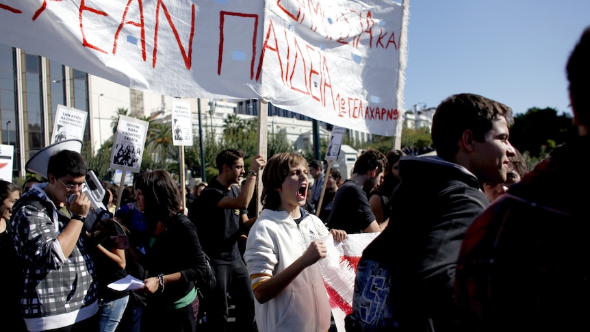 People demonstrate in front of the Greek parliament (AFP: Angelos Tzortzinis)