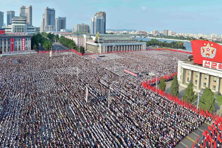 A general aerial view of thousands of people rallying in Pyongyang.