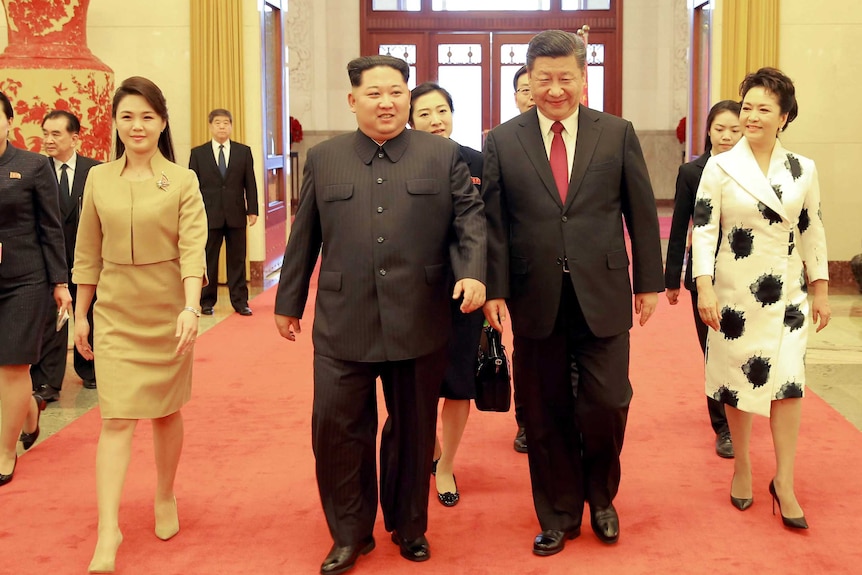 Xi Jinping walks out with Kim Jong-un