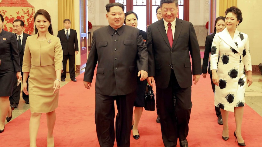 Xi Jinping walks out with Kim Jong-un