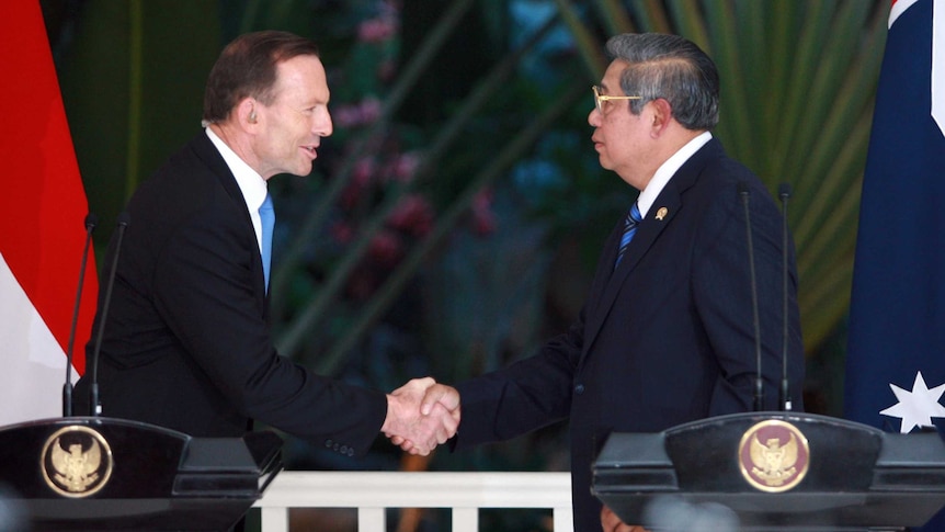 Tony Abbott shakes hands with Indonesian president Susilo Bambang Yudhoyono.