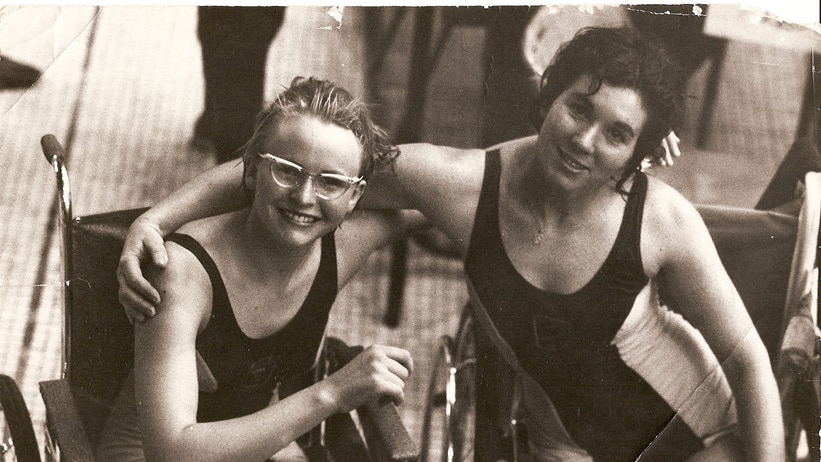 A photo in sepia - Paralympic swimmer Elizabeth Edmondson and friend sit together.