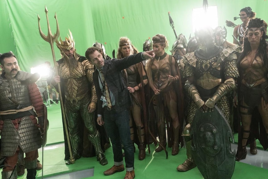 Zack Snyder points while on the set of 2017's Justice League