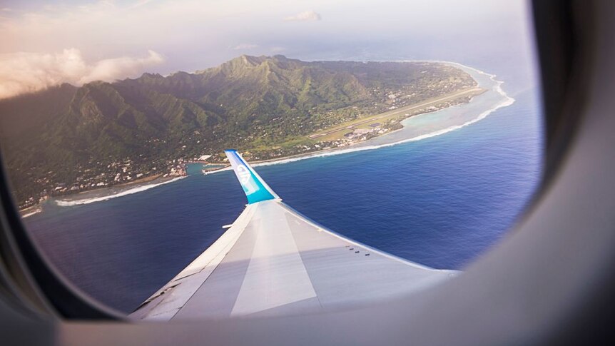 View out of a plane window looking down on Rarotonga