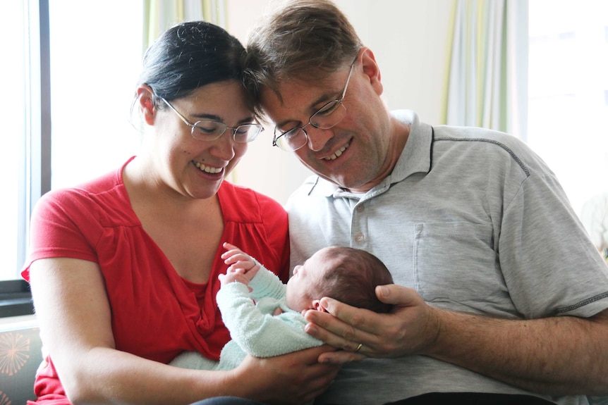 Susan and Robert Nichols hold their baby boy.
