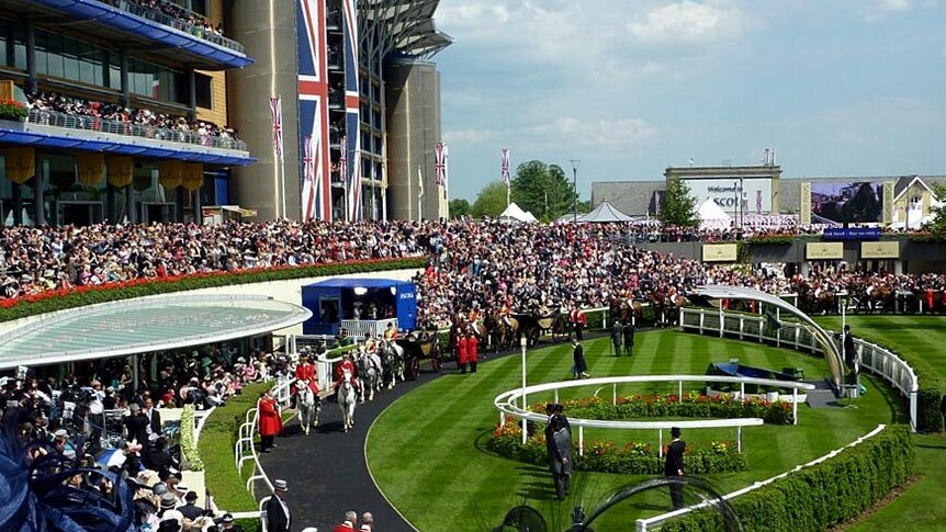 The Royal Procession passes through the parade ring at Royal Ascot.