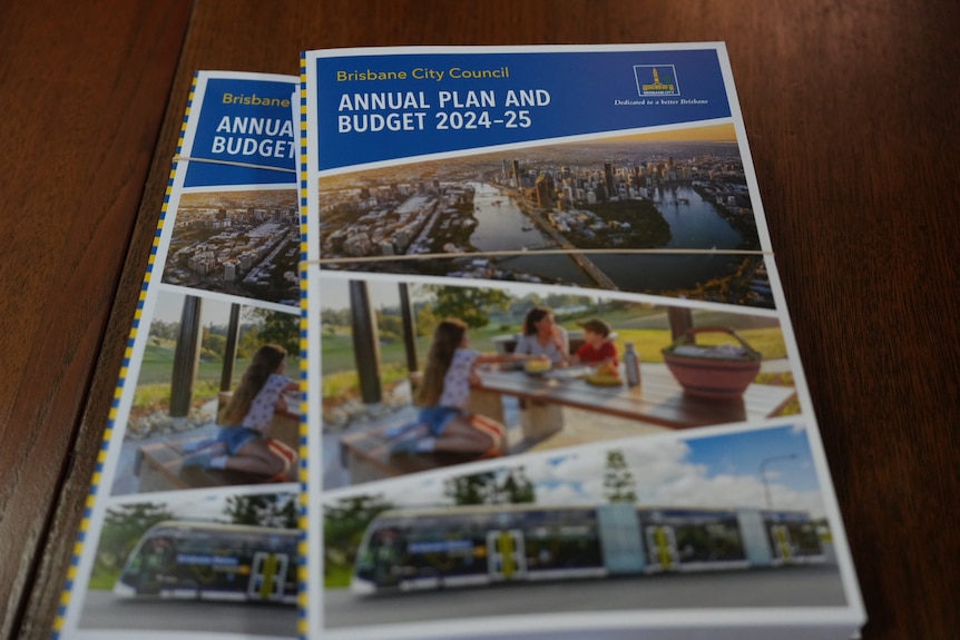 Stacked booklets of Brisbane City Council's 2024/25 budget.