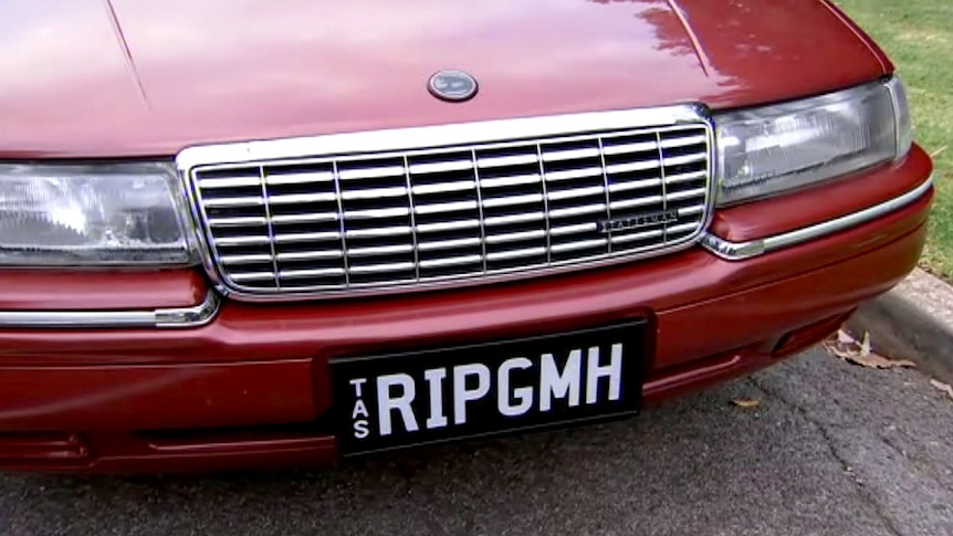 Customised Holden number plate that states RIP GMH.