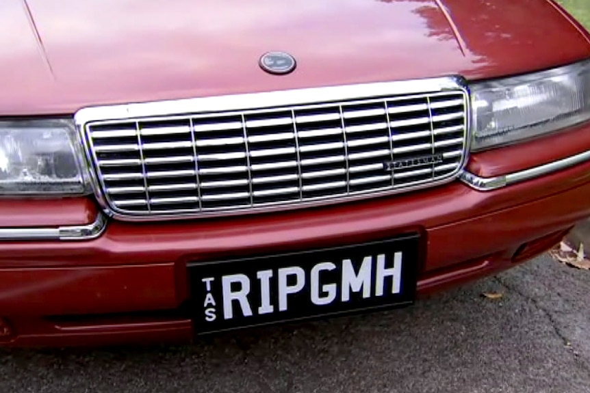 Customised Holden number plate that states RIP GMH.
