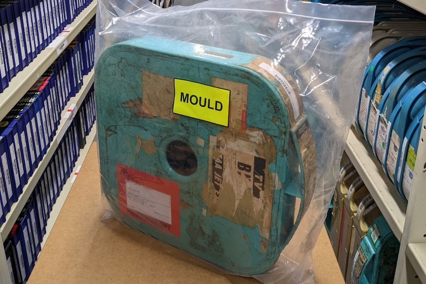 A battered case in an evidence bag with a label saying 'mould' on the front.