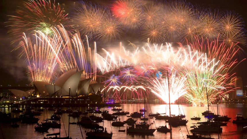 Fireworks light up the Sydney Harbour Bridge during the annual fireworks display to usher in the new year, early January 1, 2015