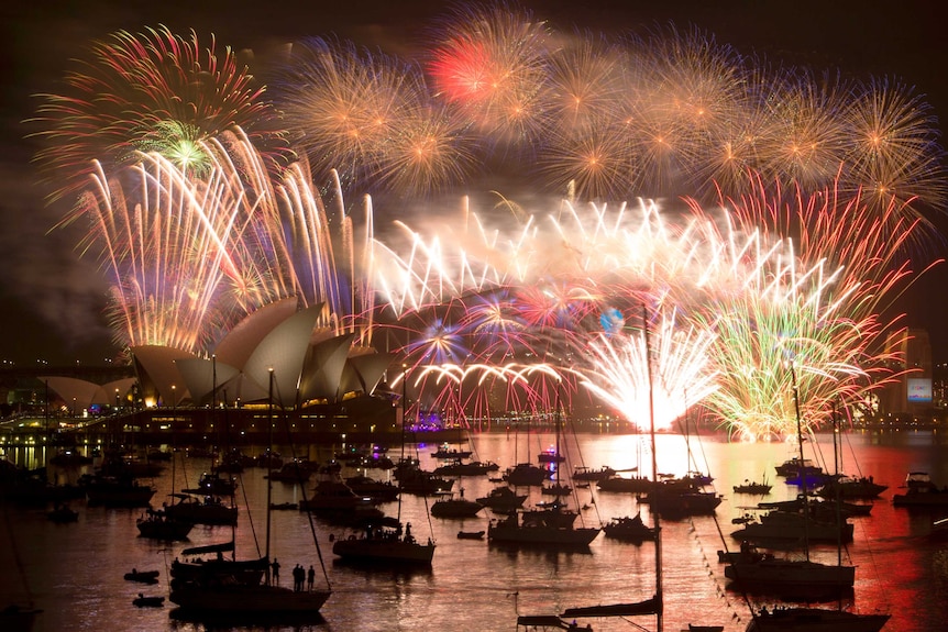 Fireworks light up the Sydney Harbour Bridge during the annual fireworks display to usher in the new year, early January 1, 2015