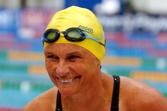 Shane Gould gets out of the pool after her 50M Butterfly heat