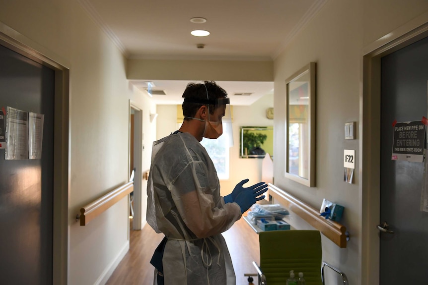 A man is dressed in personal protective equipment.