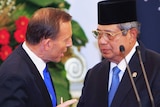 Australia's Prime Minister Tony Abbott talks to Indonesia's president Susilo Bambang Yudhoyono.