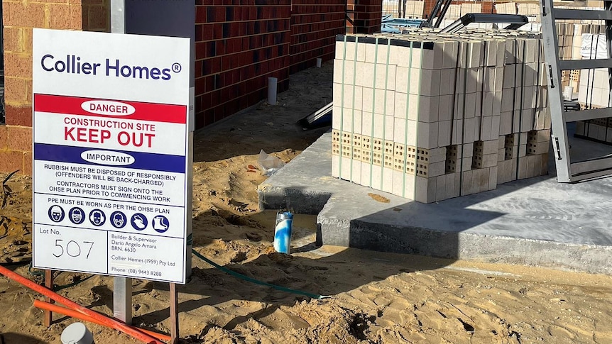 A Collier Homes sign outside a building construction site.