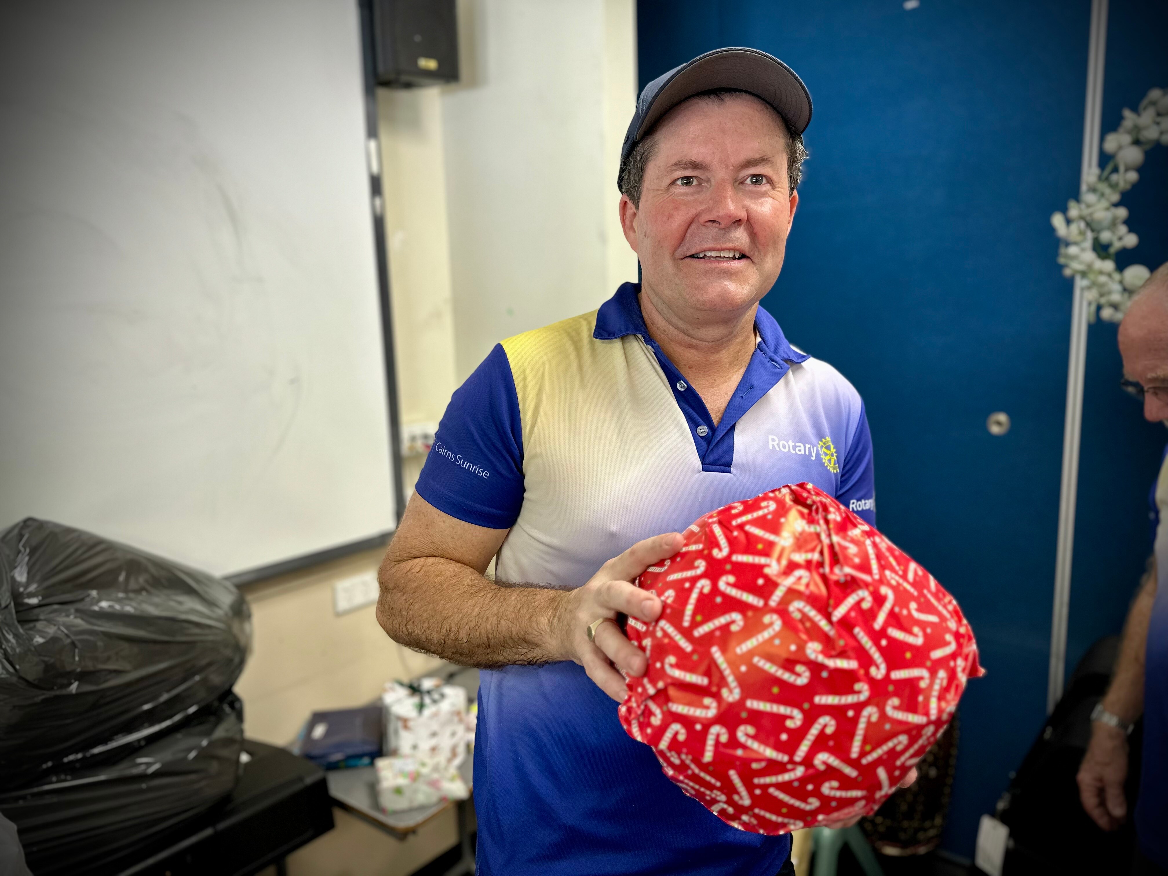 man holding a present