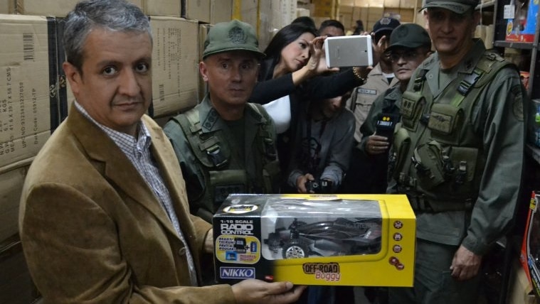 Venezuelan pricing agency director William Contreras with seized toys