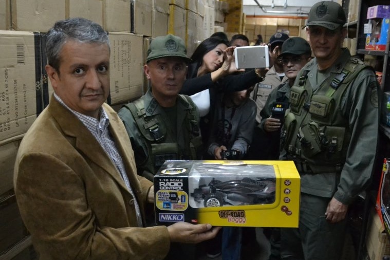 Venezuelan pricing agency director William Contreras with seized toys