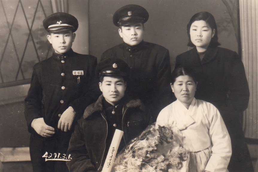 Lee, furthest to the left, with his two brothers, his sister and his mother in South Korea