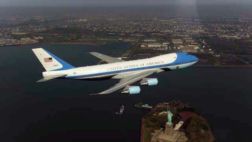 Air Force One flying over New York and the Statue Of Liberty