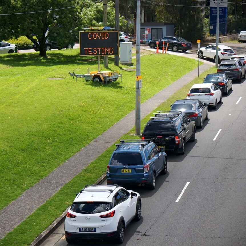 A line of cars queuing for a COVID test in northern Sydney.