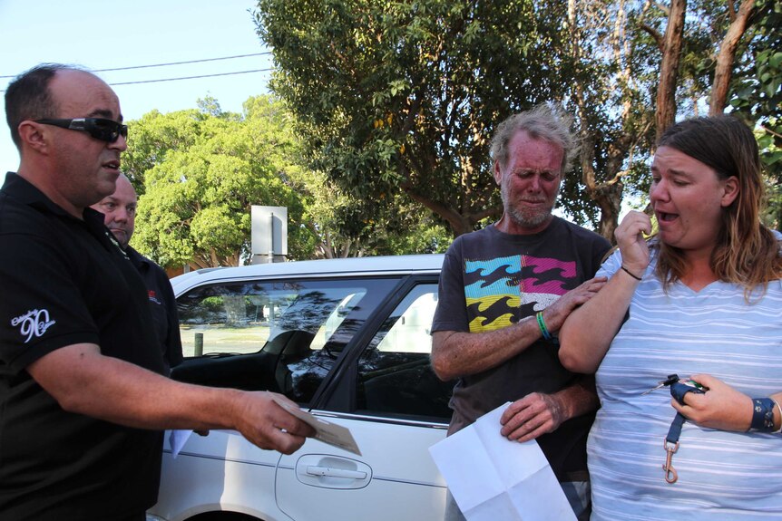 Mechanic Mick Marendy gives homeless couple David Irving and his partner Denise food and fuel vouchers