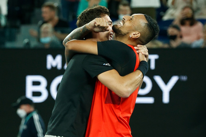 Nick Kyrgios and Thanasi Kokkinakis hug after winning the Australian Open men's doubles final.