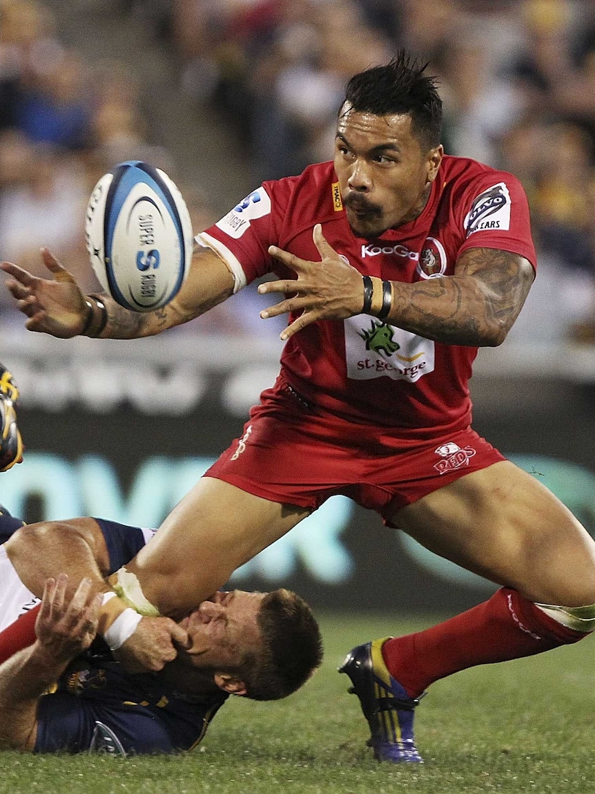 Looking for support ... Digby Ioane offloads as he is tackled by Clyde Rathbone