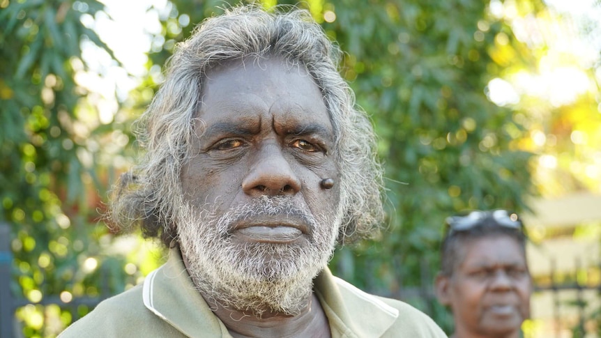 Jeffrey Malawa Dhamarrandji standing in Darwin outside a house, 2020.