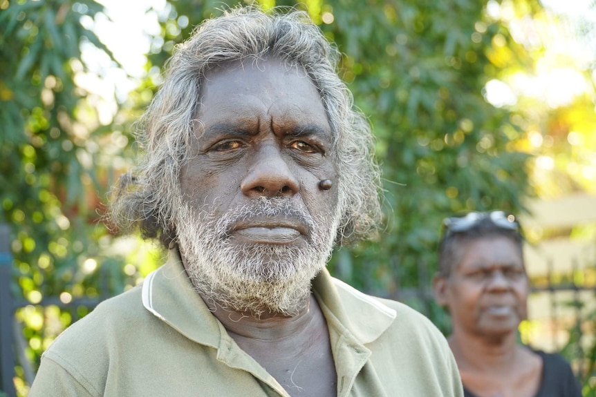 Jeffrey Malawa Dhamarrandji standing in Darwin outside a house, 2020.