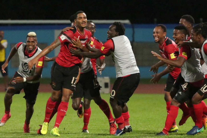 Trinidad and Tobago players celebrate after defeating the United States.