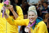Australian Opeals player Lauren Jackson holds her bronze Olympic medal and a bouquet of flowers at the 2012 London Games.