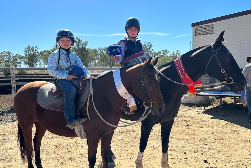Moranbah campdraft competitors Jaxon and Cruz mounted on their horses at the event
