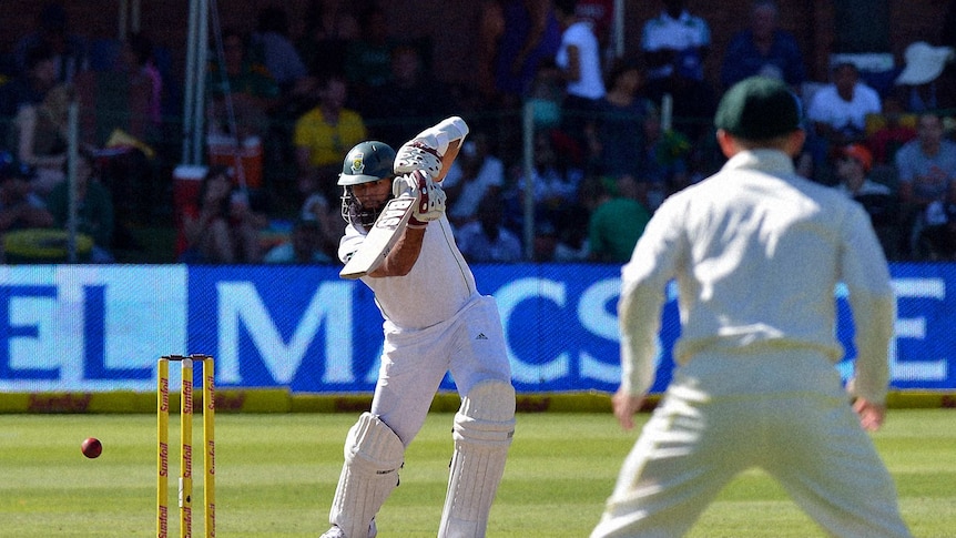 Hashim Amla drives through the covers