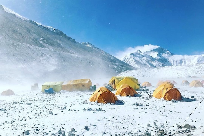 Yellow tents in the snow at the Everest Base Camp in Tibet.