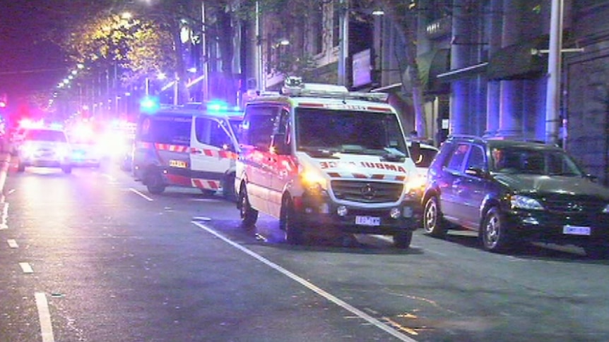 Several ambulances outside a nightclub in King Street, Melbourne where a man and woman were shot by police.