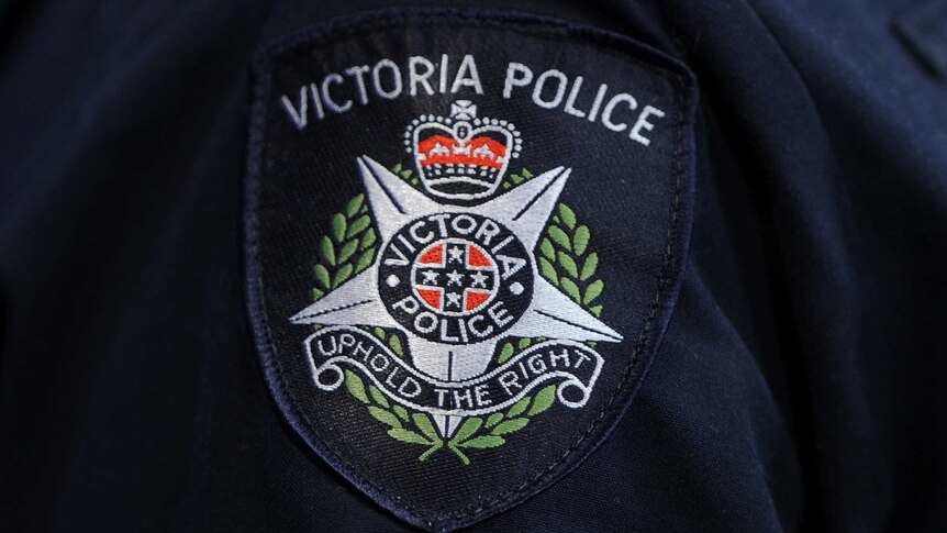 A Victoria Police logo.