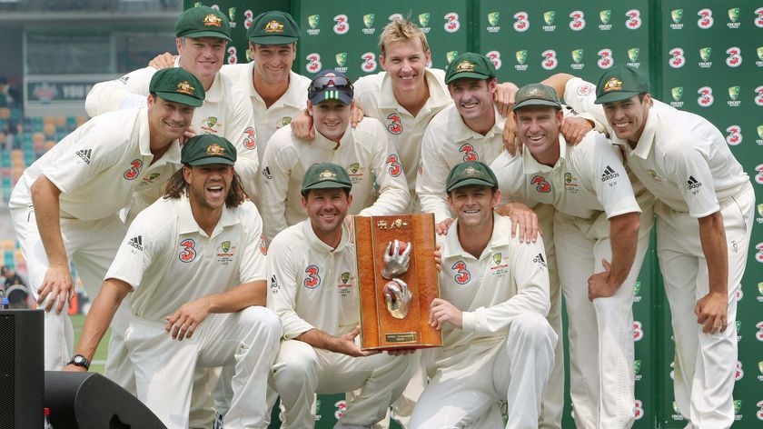 Clean sweep ... The Australian team pose with the Warne-Muralidaran Trophy