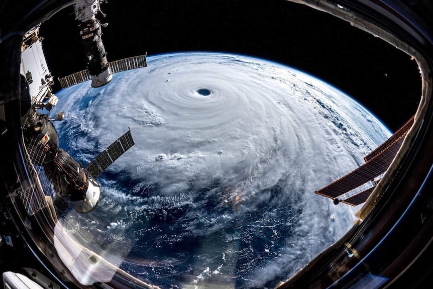 A bird's eye view of the typhoon swirling above the earth, captured from NASA satellite cameras.