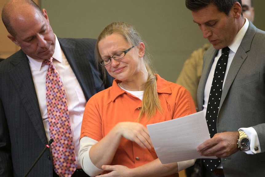 Angelika Graswald cries in court as she is flanked by her lawyers.