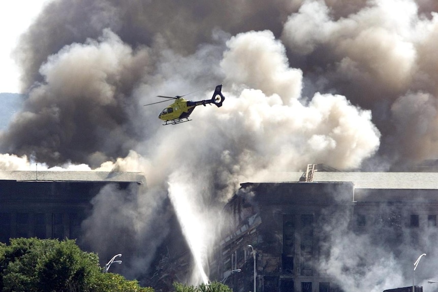 Rescue helicopters surveys damage to the Pentagon