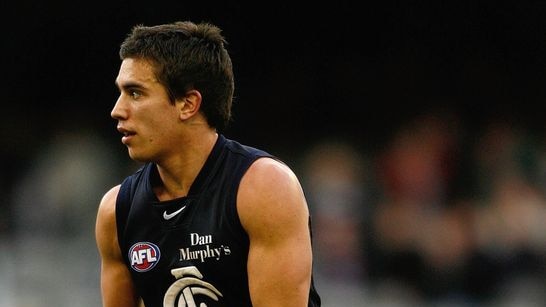 Andrew Carrazzo of Carlton runs with the ball