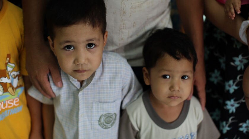 Long wait: two Afghan boys in Indonesian housing detention.